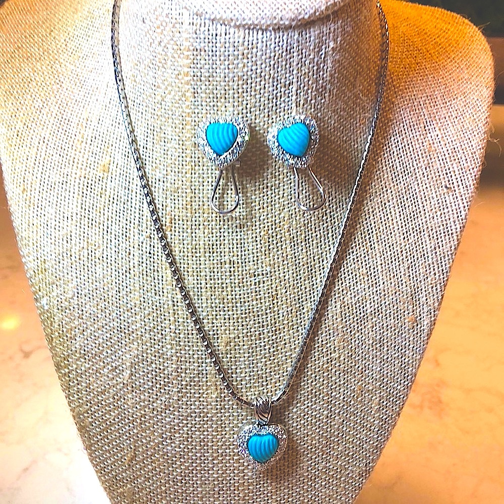 Necklace with heart pendant and earrings.